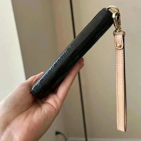 Michael Kors Black Wristlet with Gold Accents - Picture 9 of 14